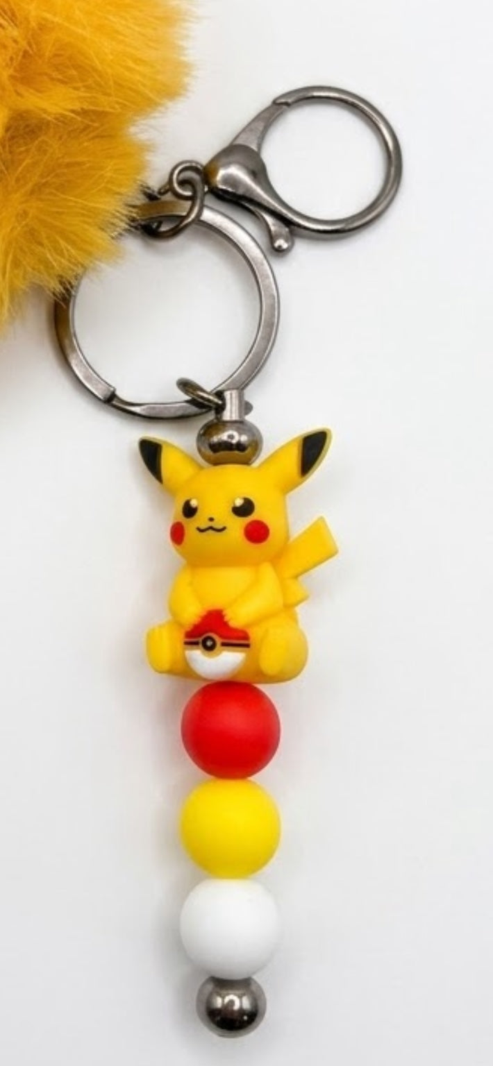 Porte-clés figurine pikachu avec pompon moutarde